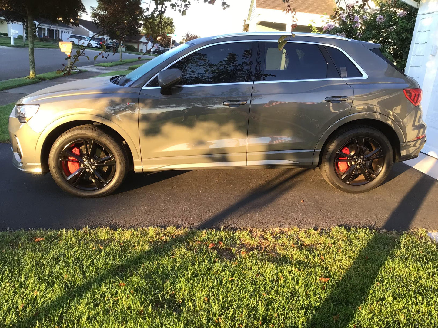 Gray Audi Q3 with black rims parked on a driveway